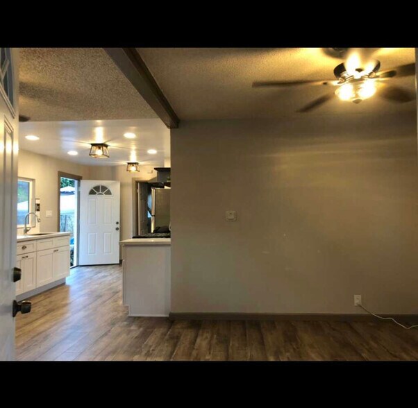 Open concept layout, all ceiling just renovated from popcorn to smooth ceilings and fresh paint! - 2661 Newell St