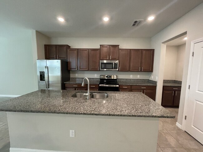 Building Photo - "Charming 3-Bedroom Wesley Chapel Home with Granite Finishes & Spacious 1,807 Sq Ft great Layout....