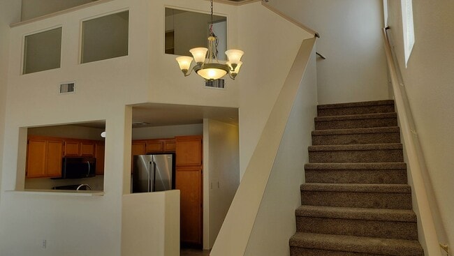 Building Photo - Townhome with Loft + Two Bedrooms/Baths - Designed for Comfort in Gated Community