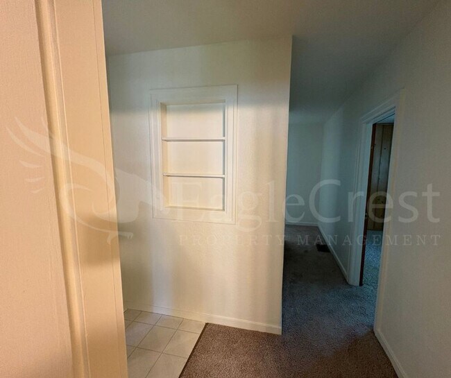 Building Photo - Three Bedroom, Two Bathroom House with Fenced Yard and Outdoor Fireplace