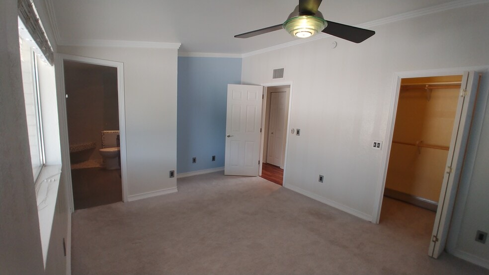Master bedroom with new ceiling fan and remote. - 539 Mallard Cir W