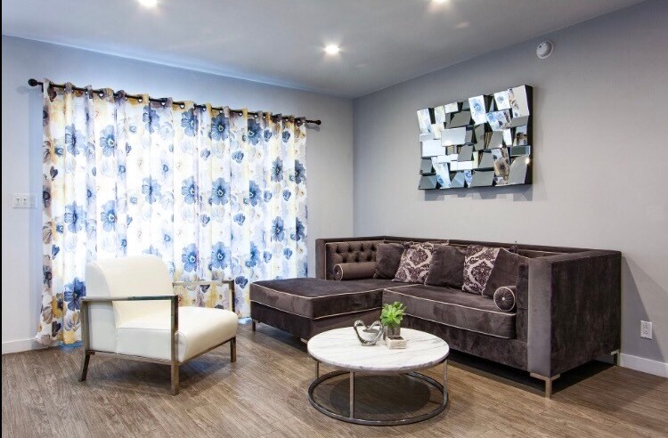 Living Room with Double paned balcony doors - The Runyon