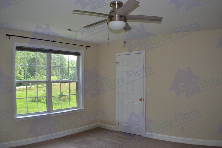 Bedroom at front of house with first of two closets. - 41195 Friendship Ct