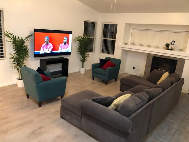 Living room with 75" flat screen TV for kicking back and watching your favorite streaming shows and - 15860 Alisa Viejo Ct