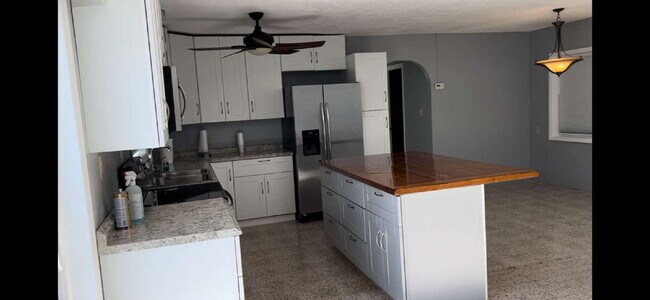 Building Photo - Charming 2-Bed Waterfront Retreat with Ter...