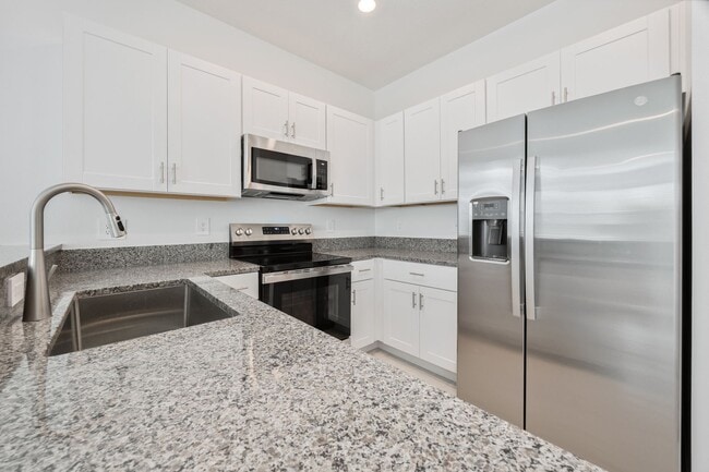 Building Photo - Brand New End Unit Townhome in Angeline Co...