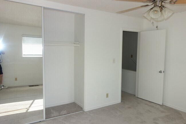 Primary bedroom with mirrored sliding door closet - 3421 E 35th St
