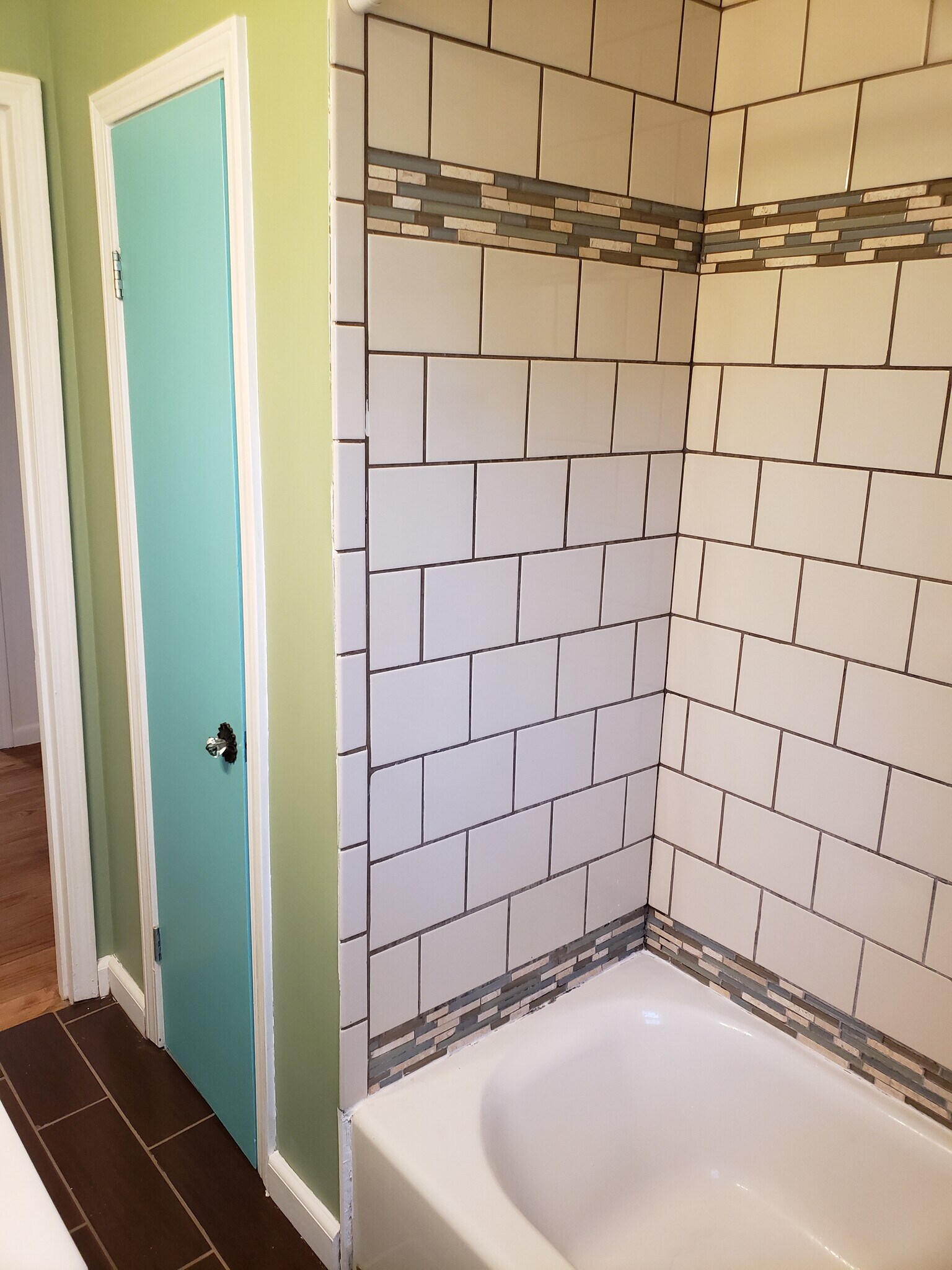 New tile in bath/shower up to the ceiling. - 10106 Wingfield Rd