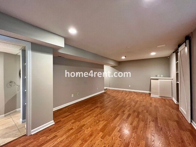 Building Photo - Updated Kitchen, Large Two Tiered Deck, Finished Basement in Blue Valley Schools!