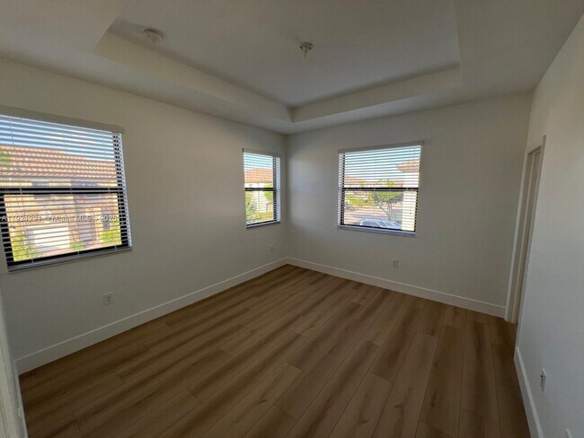 Building Photo - 9399 W 33rd Ln