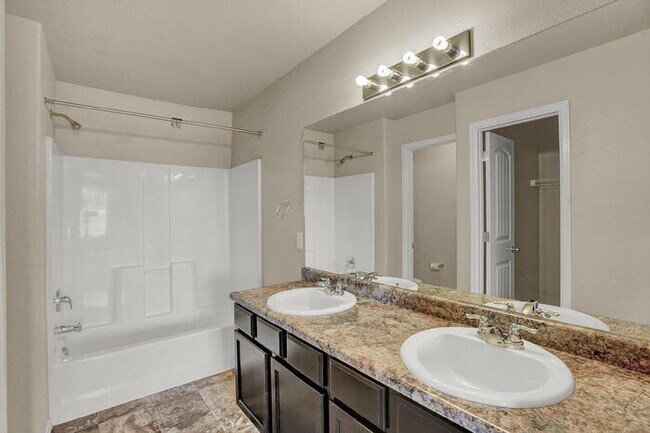 Building Photo - Modern Townhome with Central A/C, 2-Car Ga...