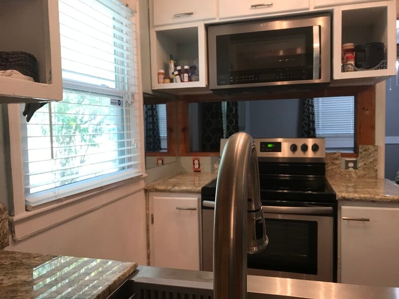 Compact kitchen with new top of line appliances convection microwave above stove - 1407 W Church St