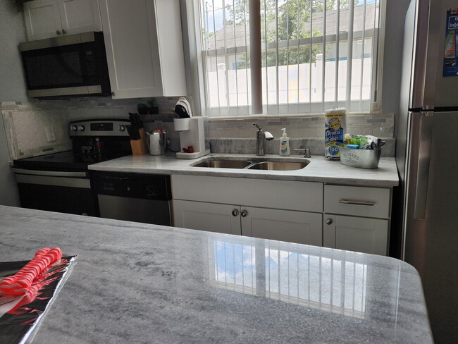 Stainless steel appliances and quartz countertop - 270 4th St NW