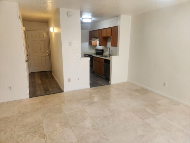 Building Photo - A Must See! Nice and bright, lots of light, two story condo in a well maintained complex.