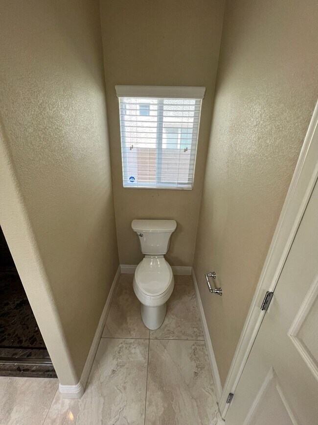 Building Photo - A Fantastic 4 Bedroom Home with the primary Downstairs, in Silverado Ranch