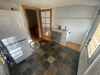 laundry / mudroom with stairs to basement office - 1615 Hooker St