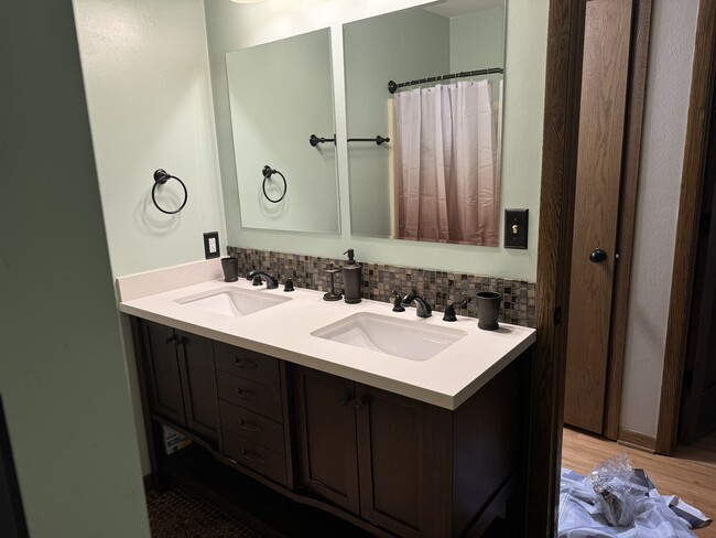 double vanity bathroom - 4449 Charles St