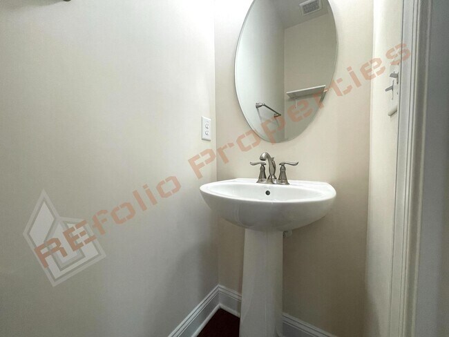 Building Photo - Beautiful 3 Story 3 Bedroom Townhouse with Huge 1st Floor Flex Space with Access to Patio + 2 Car...