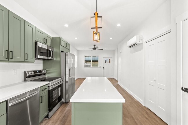 Building Photo - Brand new 2 bed/2 bath, central a/c, dishwasher, washer & dryer, deck & patio! March rent free!