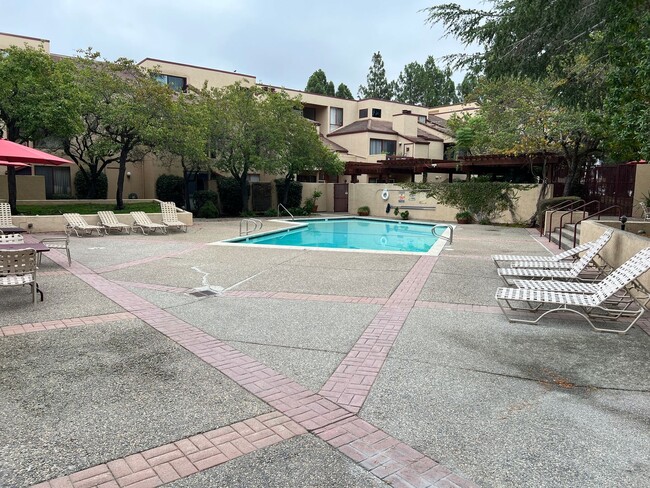 Building Photo - GATED COMMUNITY WITH POOL & HOT TUB NESTLE...