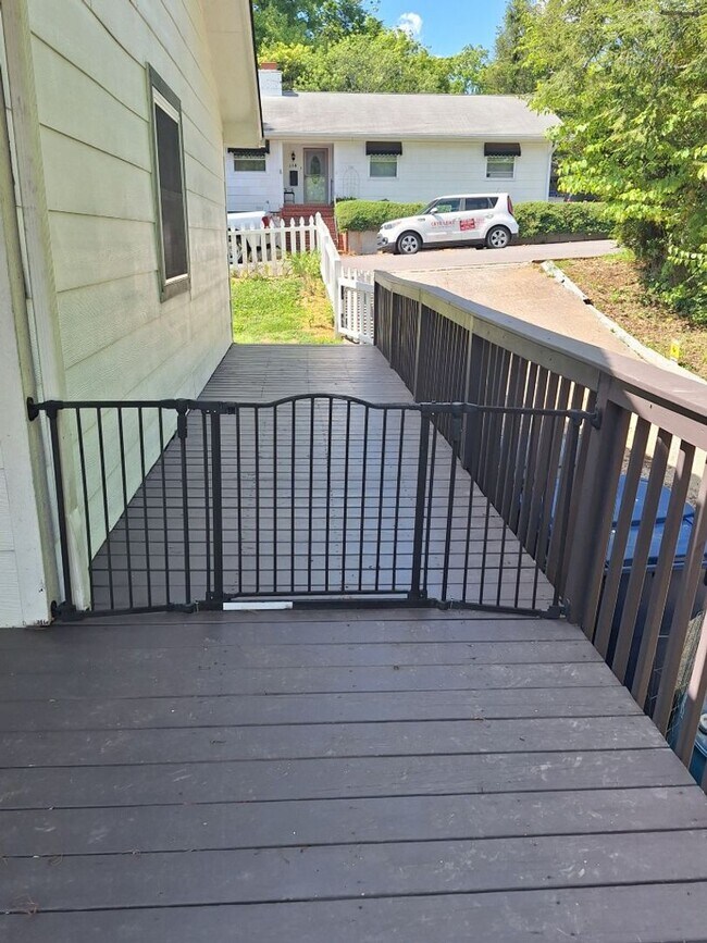 Building Photo - Cute white cottage with white picket fence & Huge deck off back door!