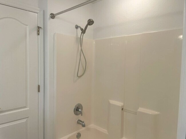 Building Photo - Elegant 3 Bedroom End-Unit Condo with Screened Lanai & Pond Views and A Private Garage