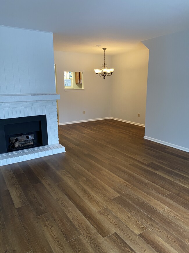 Living room with gas fireplace looking into the dining area - 632 Northview Ave