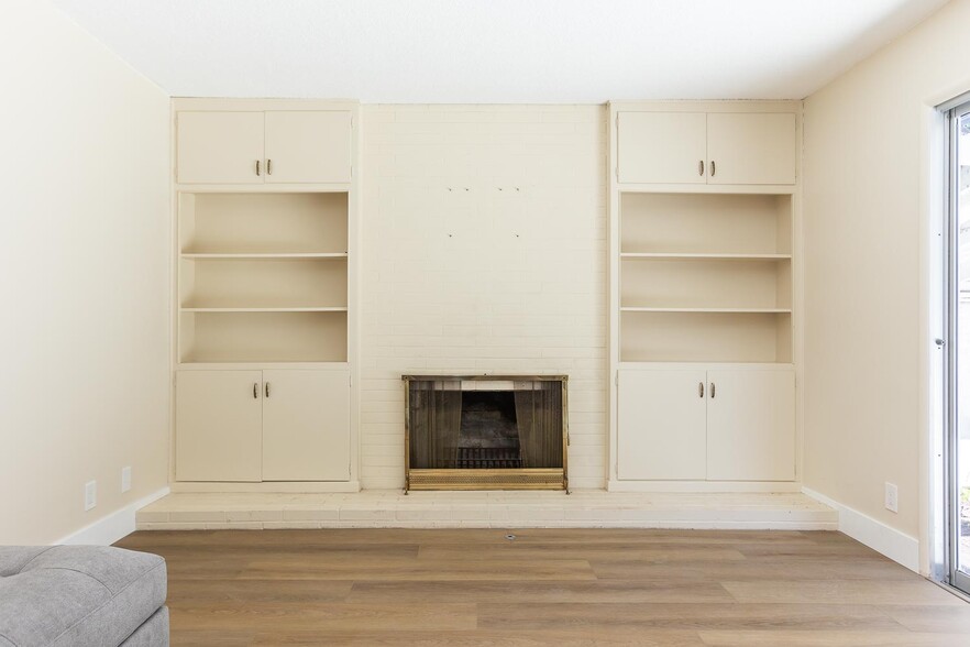 Shelving and fire place in living room - 679 Rancho Dr