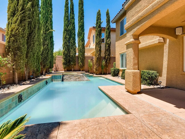Building Photo - LUXURIOUS UPGRADED HOME IN A GATED SUMMERLIN AREA!!HOUSE HAS POOL AND SPA AND PATIO COVERED BACKY...