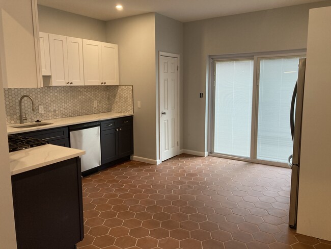 From the dining room you enter the luxurious kitchen, with brand new everything: wood cabinetry, til - 2621 E Somerset St