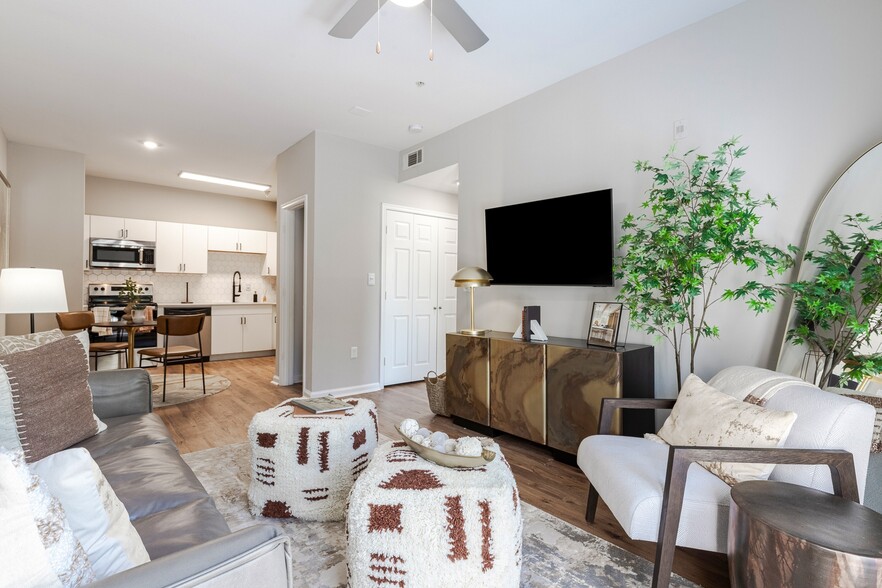 Newly Renovated Living Room with Hardwood-Style Flooring - Deep Deuce at Bricktown Apartments