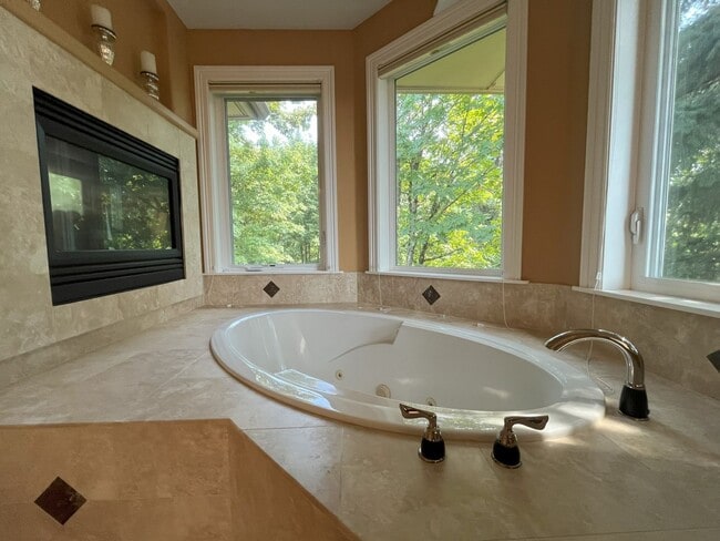 Building Photo - Forest-View Luxury Home with 5 Bedrooms, Luxury Primary Suite & Gourmet Kitchen