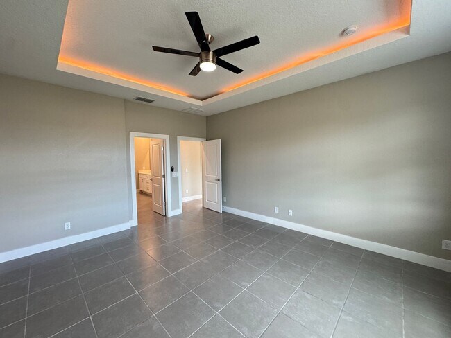 Building Photo - Spacious 4-Bedroom Home in Poinciana – Internet Included & No HOA Approval Required