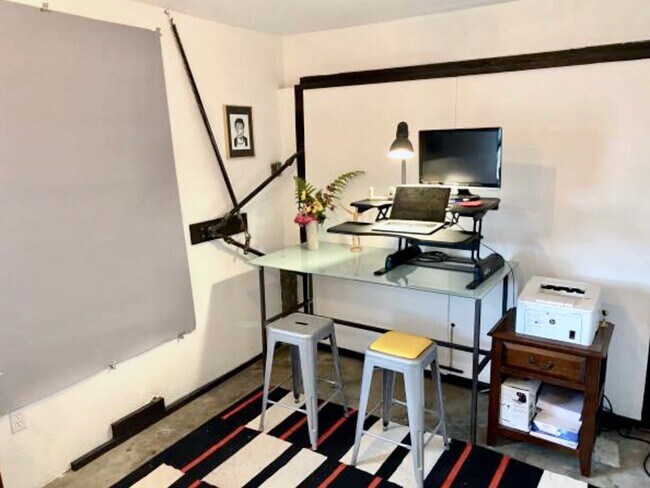 Garage/Studio shown furnished to illustrate its flexible use. - 1672 Rotary Dr
