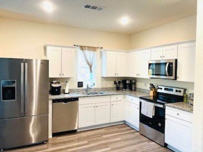 Building Photo - Spacious Open-Concept Home Next to Gated D...