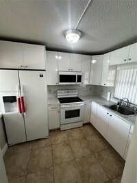 Building Photo - 6565 W 26th Dr