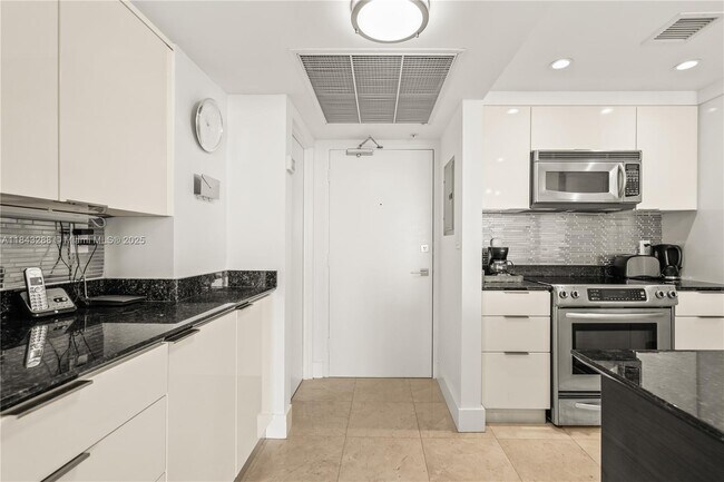 Building Photo - 10275 Collins Ave