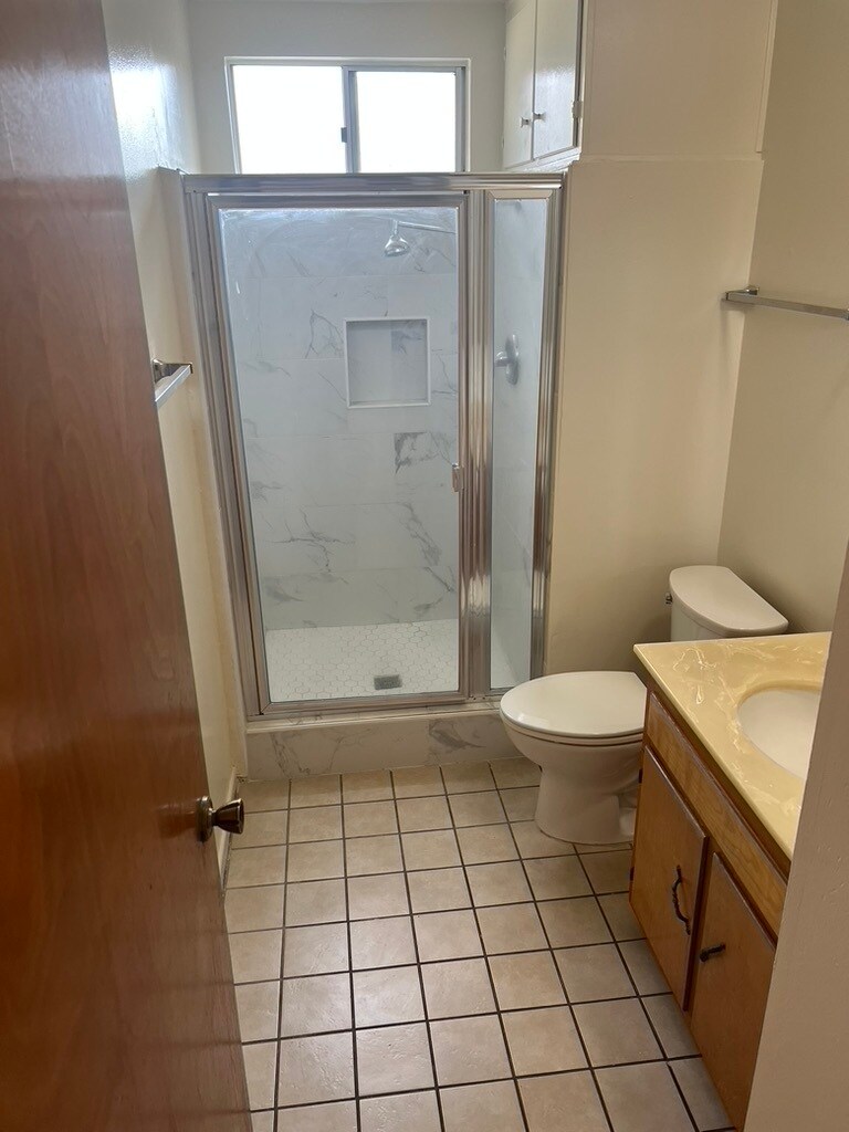 Hallway bathroom with new modern marble stall shower - 3262 Montrose Ave