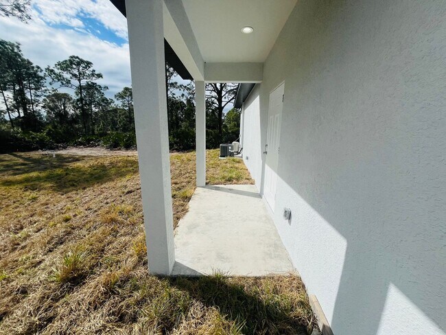 Building Photo - BRAND NEW ONE BEDROOM, ONE BATH-ONE CAR GARAGE- LEHIGH ACRES