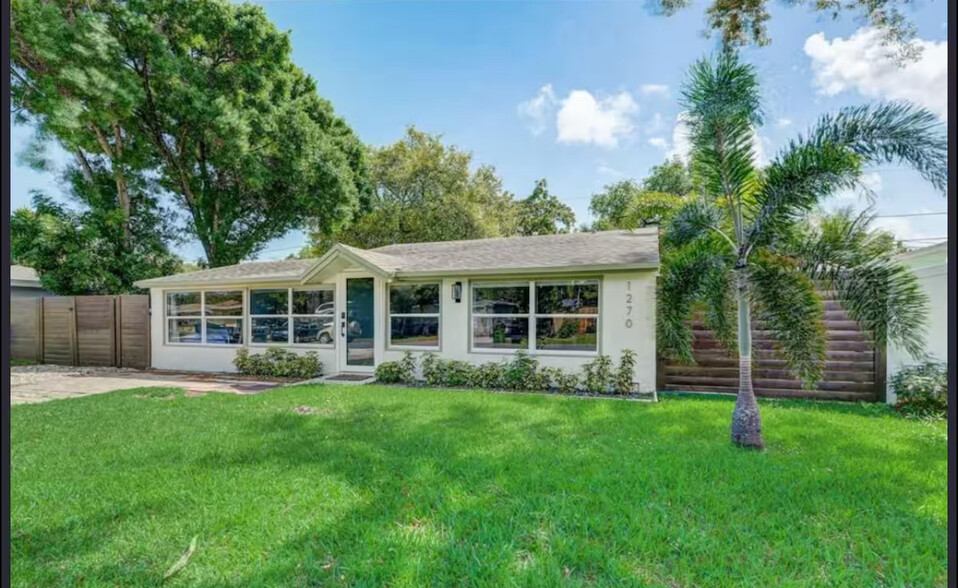 EXTERIOR FRONT- this home offers an abundance of natural light with it's many windows. - 1270 SW 29th St