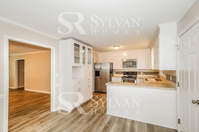 Building Photo - The living is easy in this 4 bedroom, 2 bathroom home