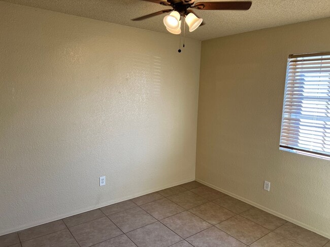 Building Photo - Four Bedroom Mountain View Home with large fenced back yard and double gates