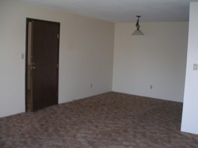 Living Room/Dining Room - Acres Apartments