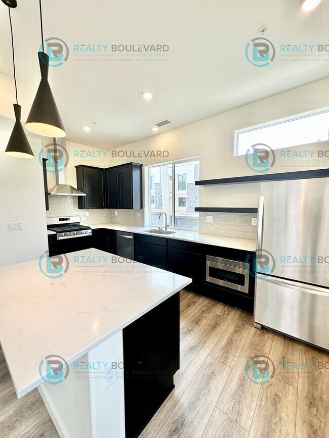 Building Photo - Modern 2 Bedroom 2Bath  Townhome with Dual Patios & Designer Finishes near Truckee River