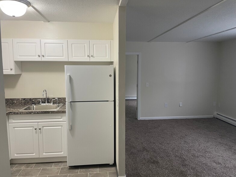 1 Bedroom Living Room + Kitchen - Scott Gardens Apartments