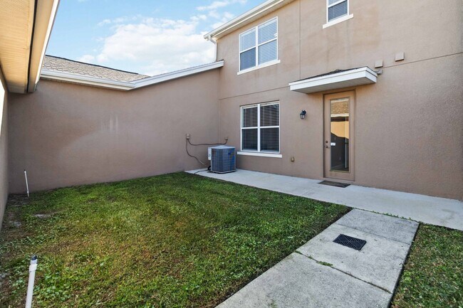 Building Photo - Beautiful Townhome with Private Courtyard & 2-Car Garage Near Lake Nona