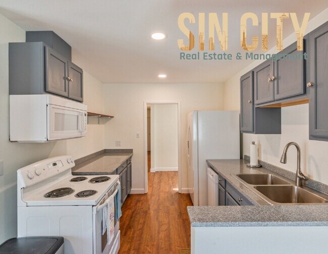Building Photo - "Charming 4-Bedroom Retreat in Las Vegas –...
