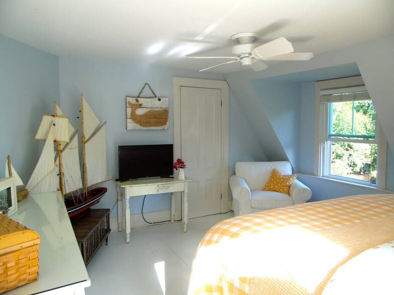 The OCEAN VIEW KING Guest Room with a flatscreen and views from both windows. - 23 Graffam Rd