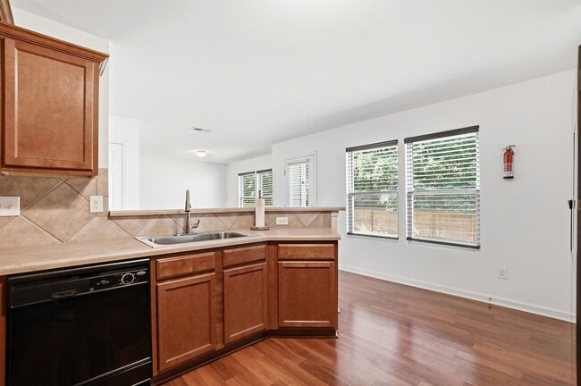 Building Photo - Spacious 4BR Home with New Carpet & Fenced Backyard