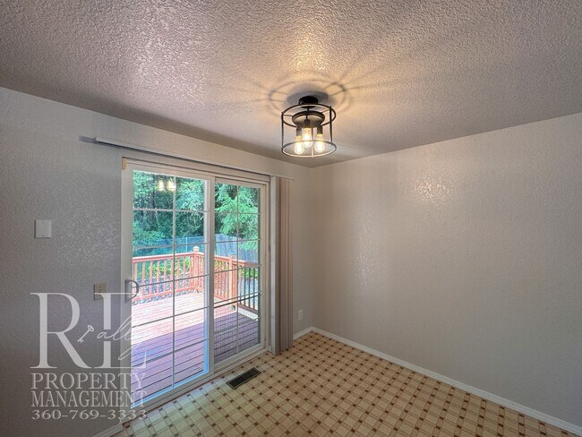 Building Photo - Freshly Painted East Bremerton Home with Expansive Decks & Flexible Living Space